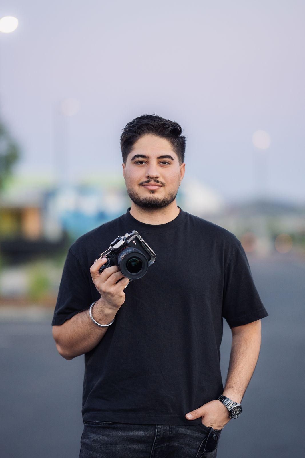Satvir Multani, founder of SM Media, holding a camera